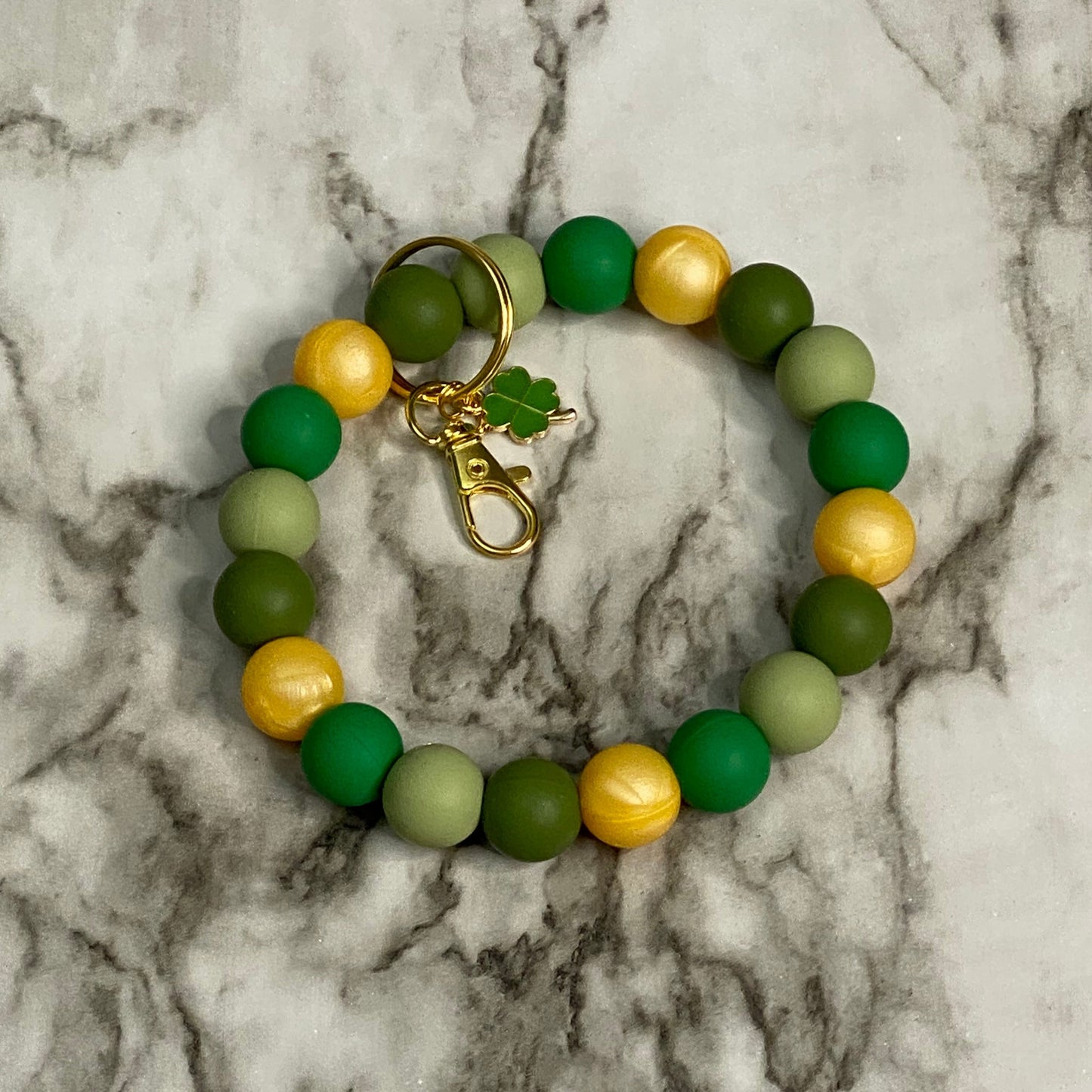 Front of Green(s) and Gold Beaded with Shamrock Charm St. Patrick's Day Wristlet Keychain
