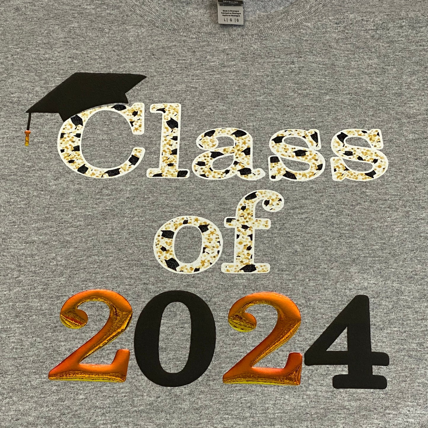 Close Up of Sublimated Class of 2024 with Puff Black, Glittery White and Holographic Gold Vinyl T-Shirt