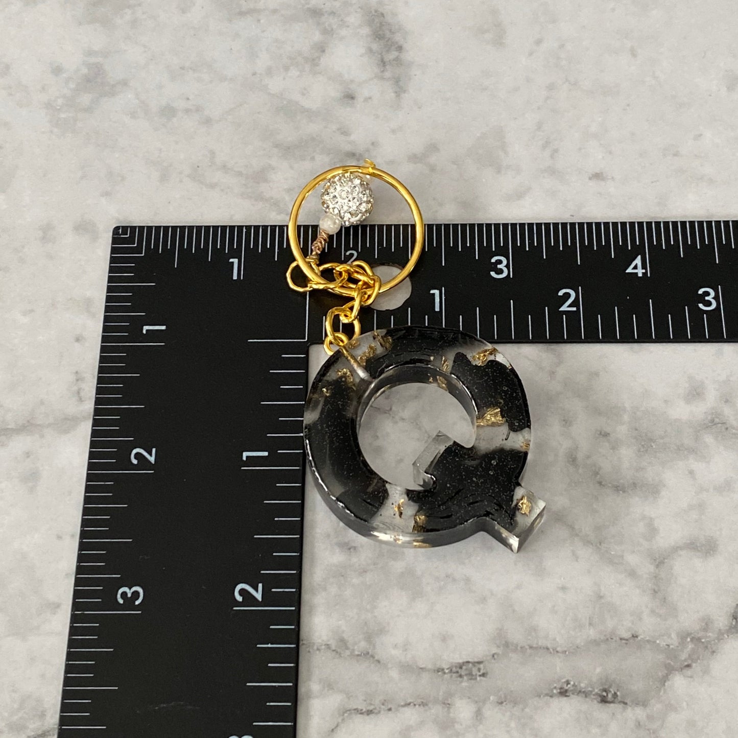 Measurement of the Letter Q, Clear Resin Alphabet Letter Keychain with Gold Flake and Black Accents