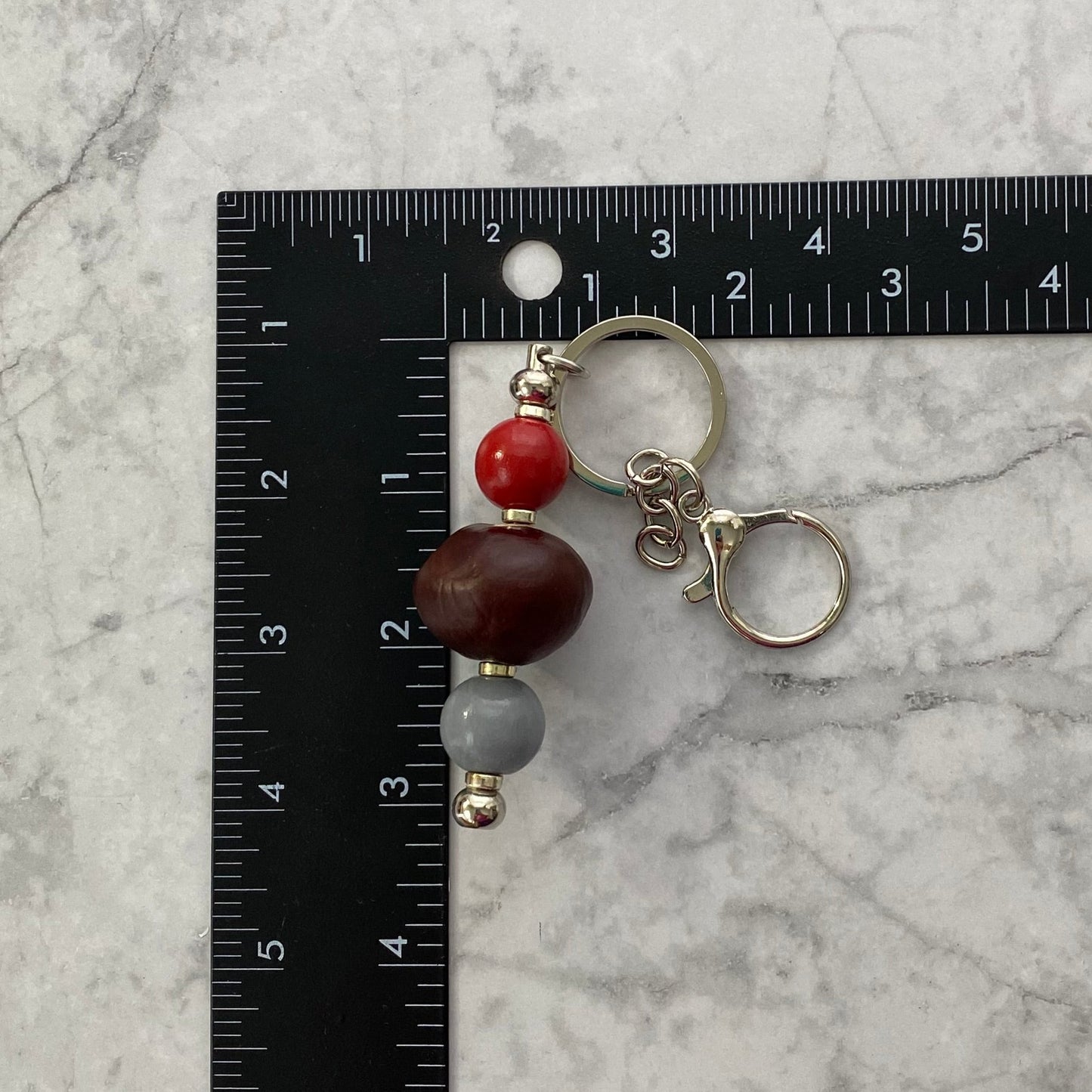 Measurement of Scarlet and Gray Wooden Beaded Bar Keychain with Buckeye
