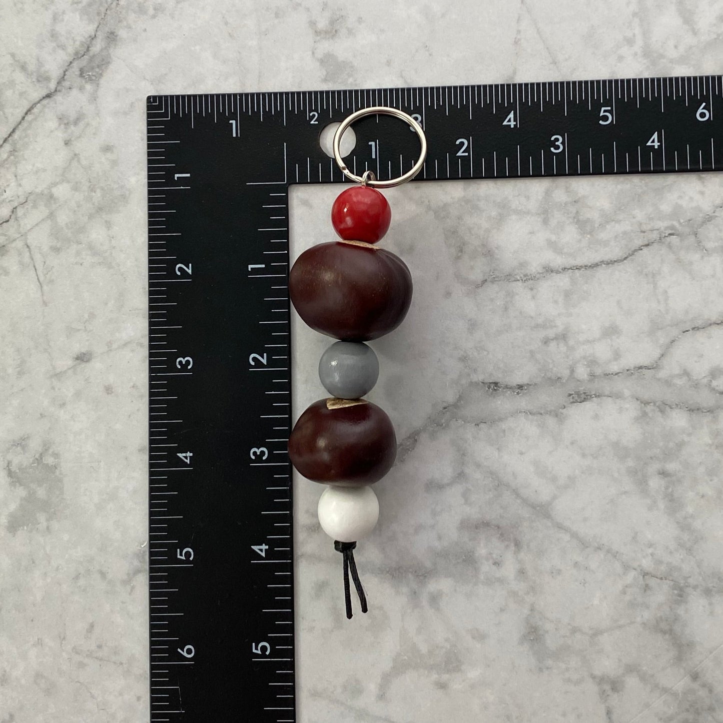 Measurment of Scarlet, Gray and White Wooden Beaded Keychain with Buckeyes