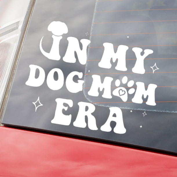 Close Up of In My Dog Mom Era Decal on the Back of a Red Car