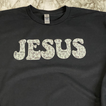 Close Up of Glittery JESUS with Black and White Cross Pattern T-Shirt