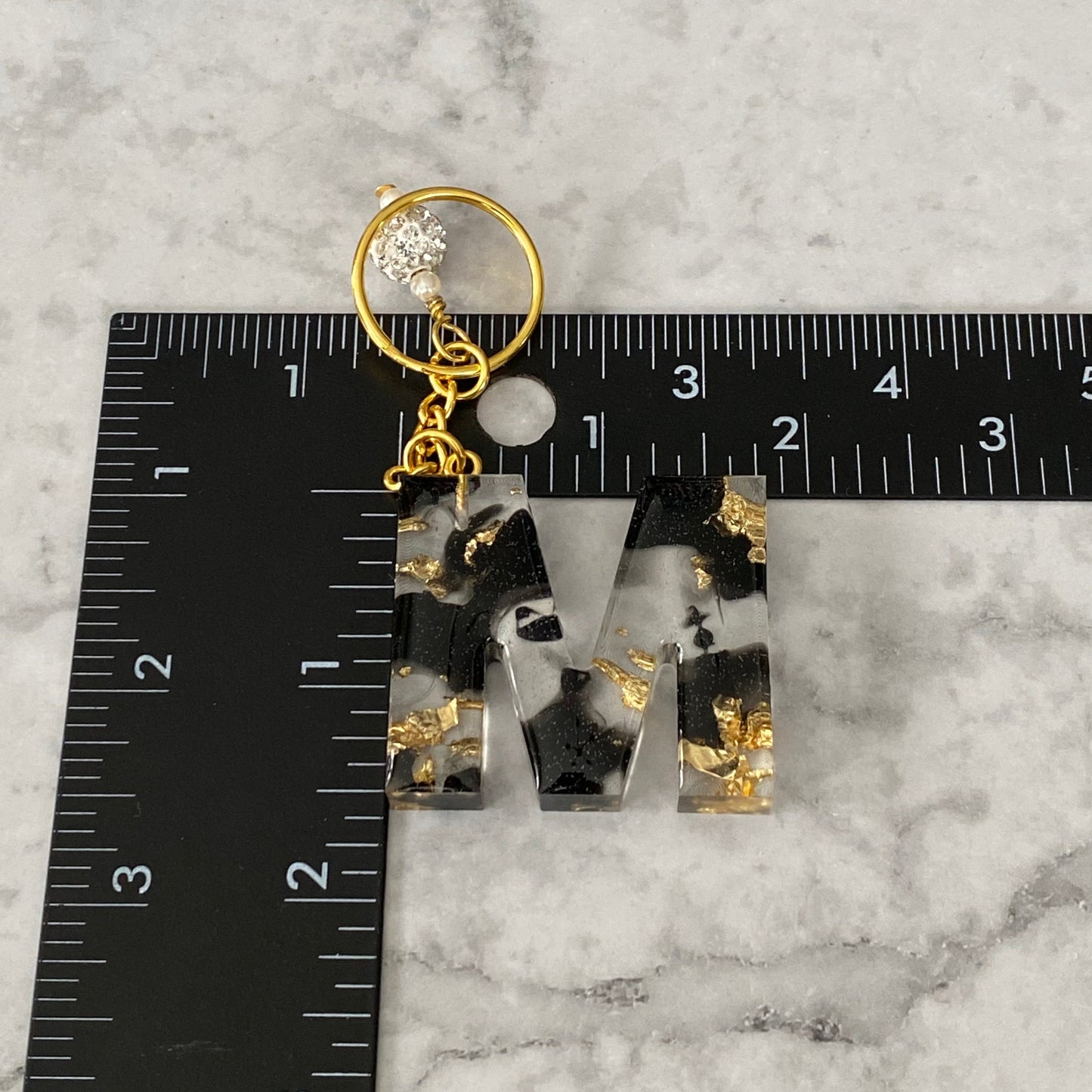 Measurement of the Letter M, Clear Resin Alphabet Letter Keychain with Gold Flake and Black Accents